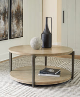 Bay Furniture Gallery - Ashley Furniture - Dyonton Coffee Table - Round Cocktail Table / Light Grayish Brown - T574-8